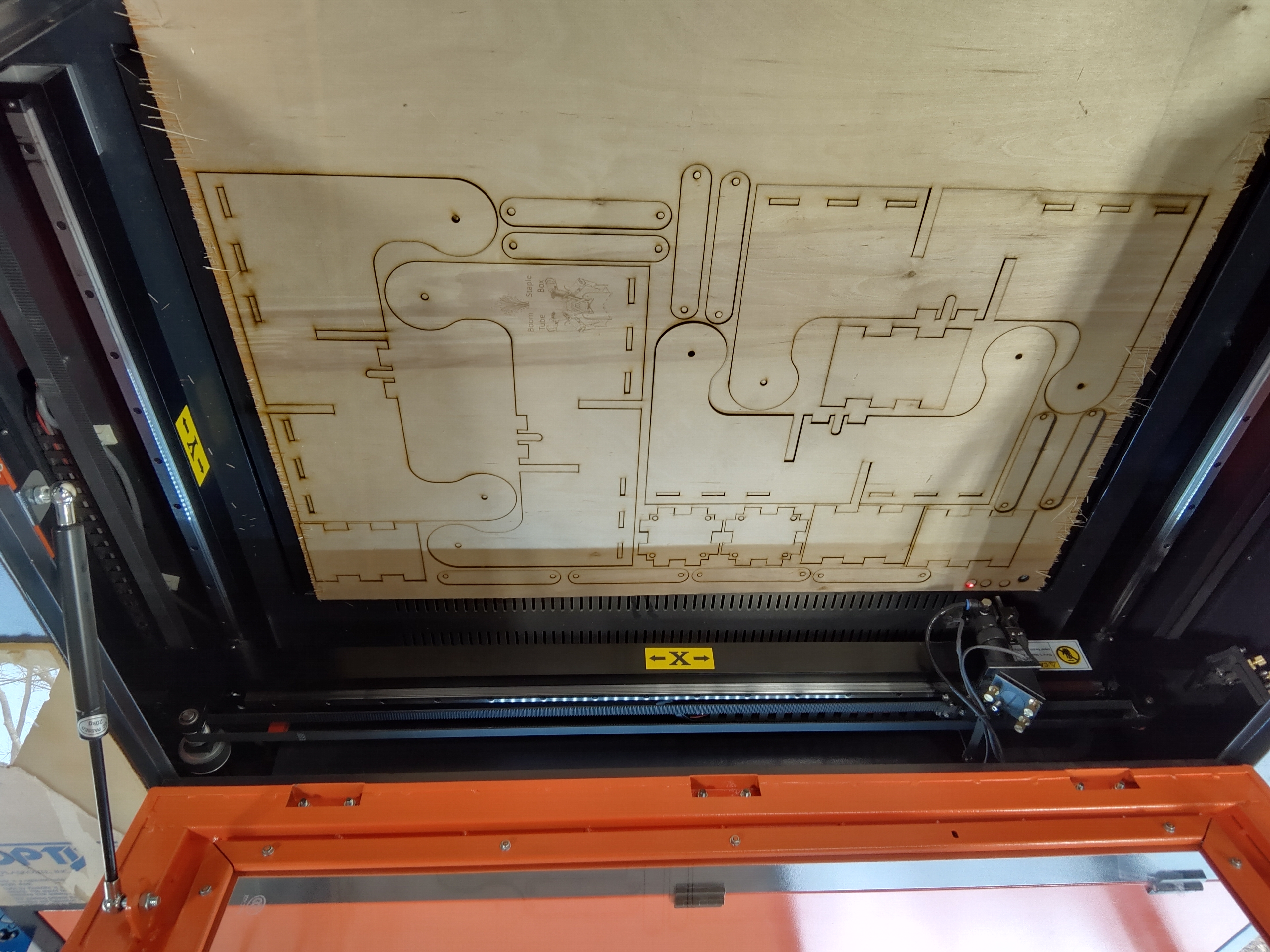 Plywood parts cut on the CO₂ laser bed